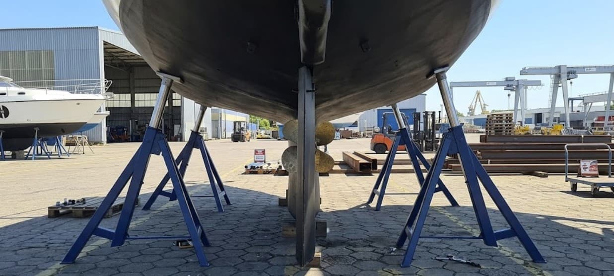 Boat stands positioned under hull